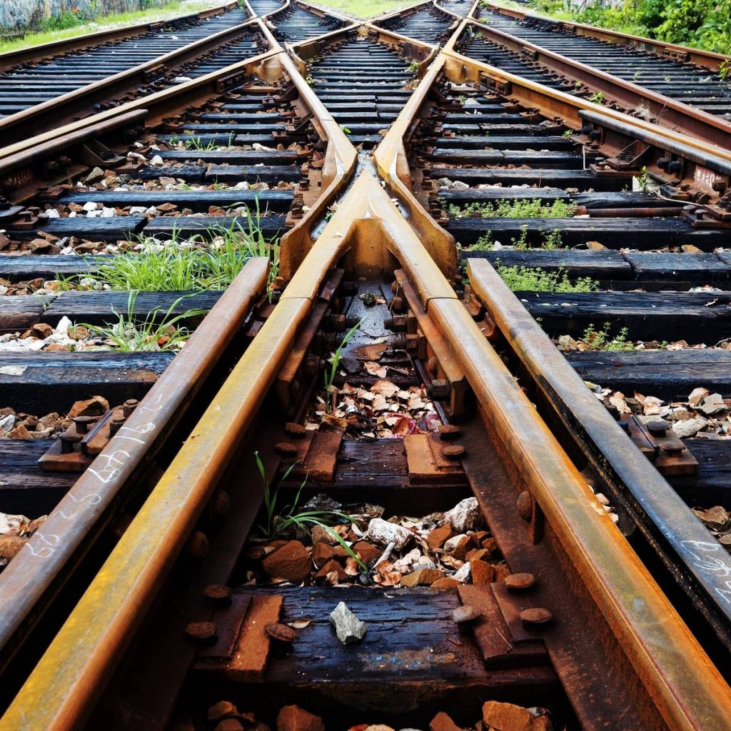 A train is moving down the track in motion.