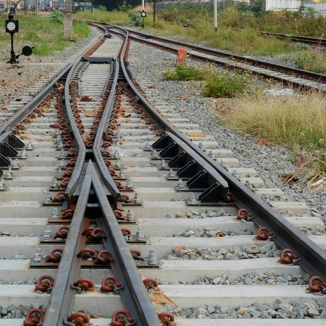 A train is moving down the track in motion.